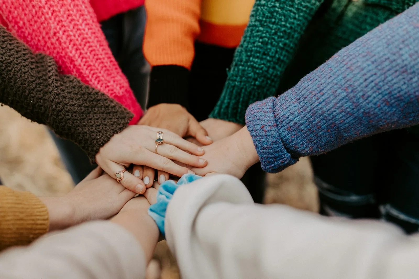 Helping hands reaching upward representing mutual support